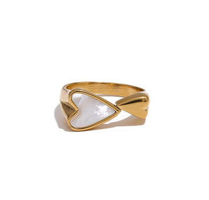 Golden ring with heart-shaped seashells
