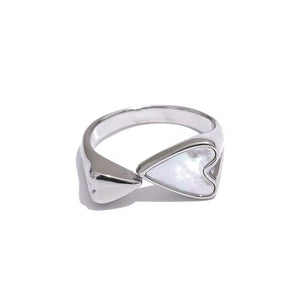 Silver ring with heart-shaped seashells
