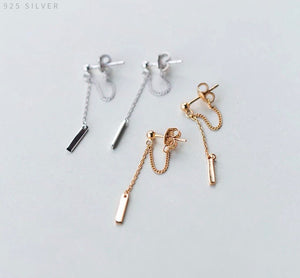 Aretes dorados de poste colgantes