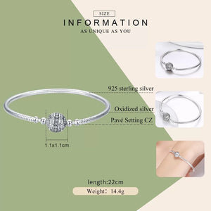 Brazalete con broche de esfera con zirconias