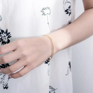 Pulsera oro doble con cruz mini