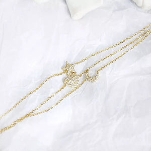 Pulsera dorada triple corazón, luna y estrella